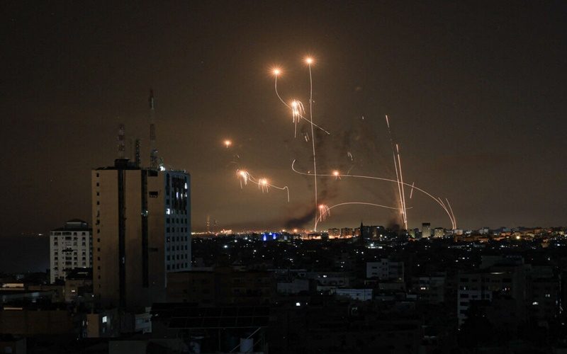 An Israeli missile launched from the Iron Dome defence missile system attempts to intercept a rocket, fired from the Gaza Strip, over the city of Netivot in southern Israel on October 8, 2023. - Israel, reeling from the deadliest attack on its territory in half a century, formally declared war on Hamas Sunday as the conflict's death toll surged close to 1,000 after the Palestinian militant group launched a massive surprise assault from Gaza. (Photo by MAHMUD HAMS / AFP)